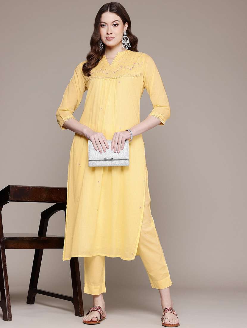 women solid with work notch neck kurta pant set