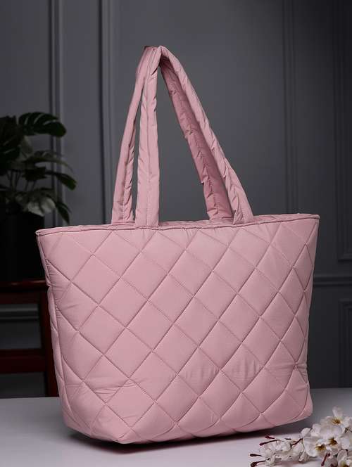 women pink quilted handbag