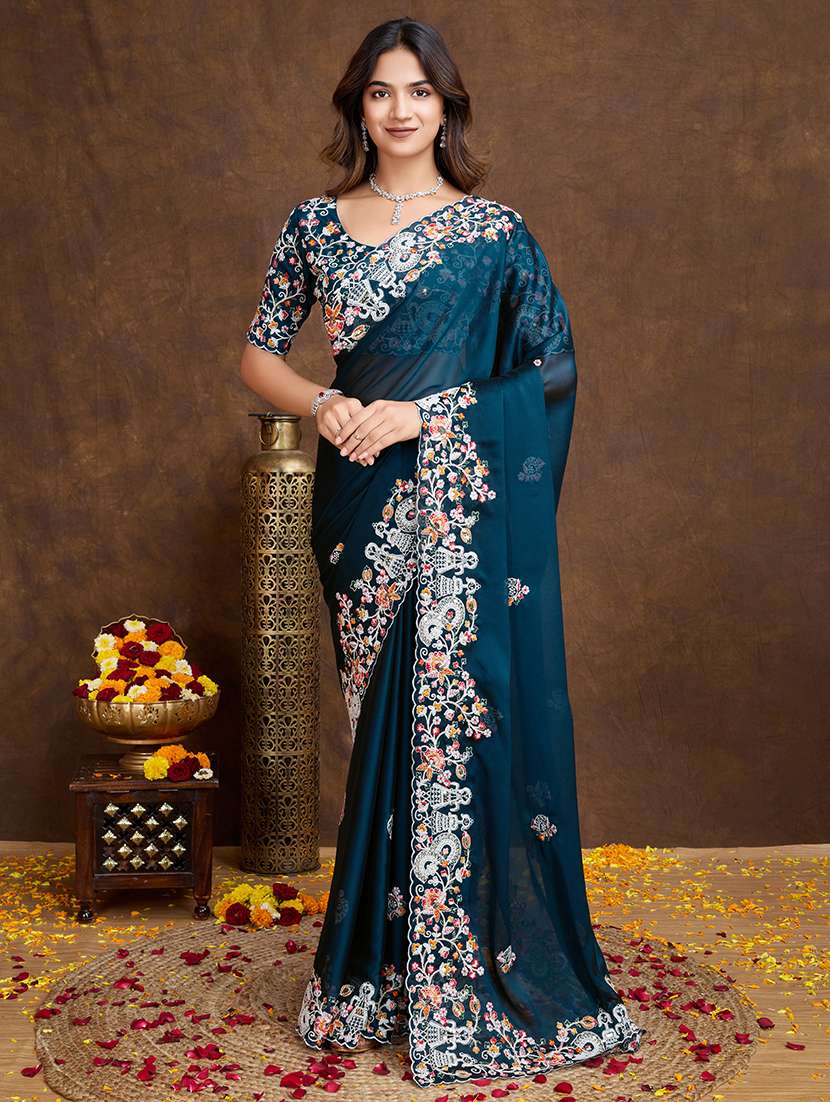 women teal embroidered saree with blouse