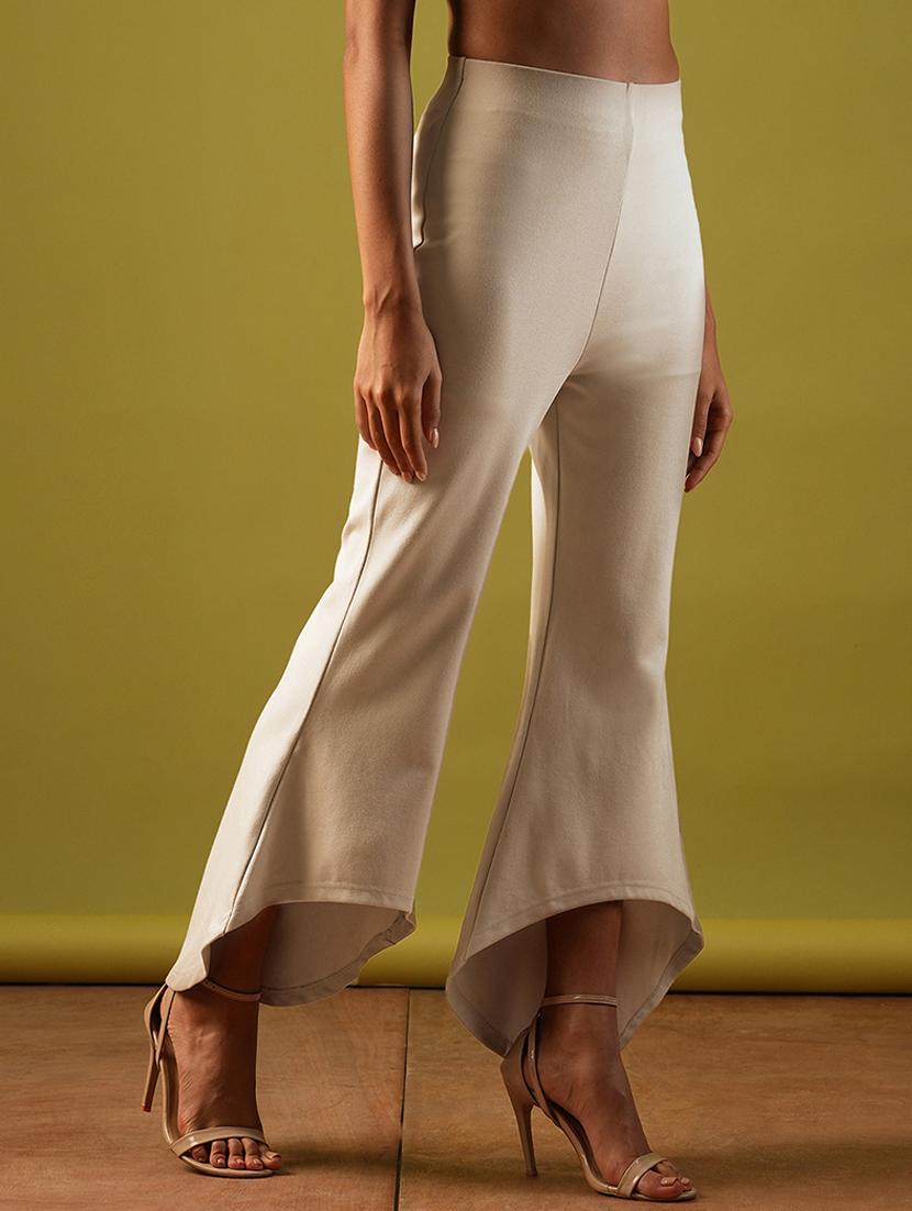 globus women beige solid stretchable mid-rise high-low bottom hem flared party treggings - 21671755 -  Standard Image - 1