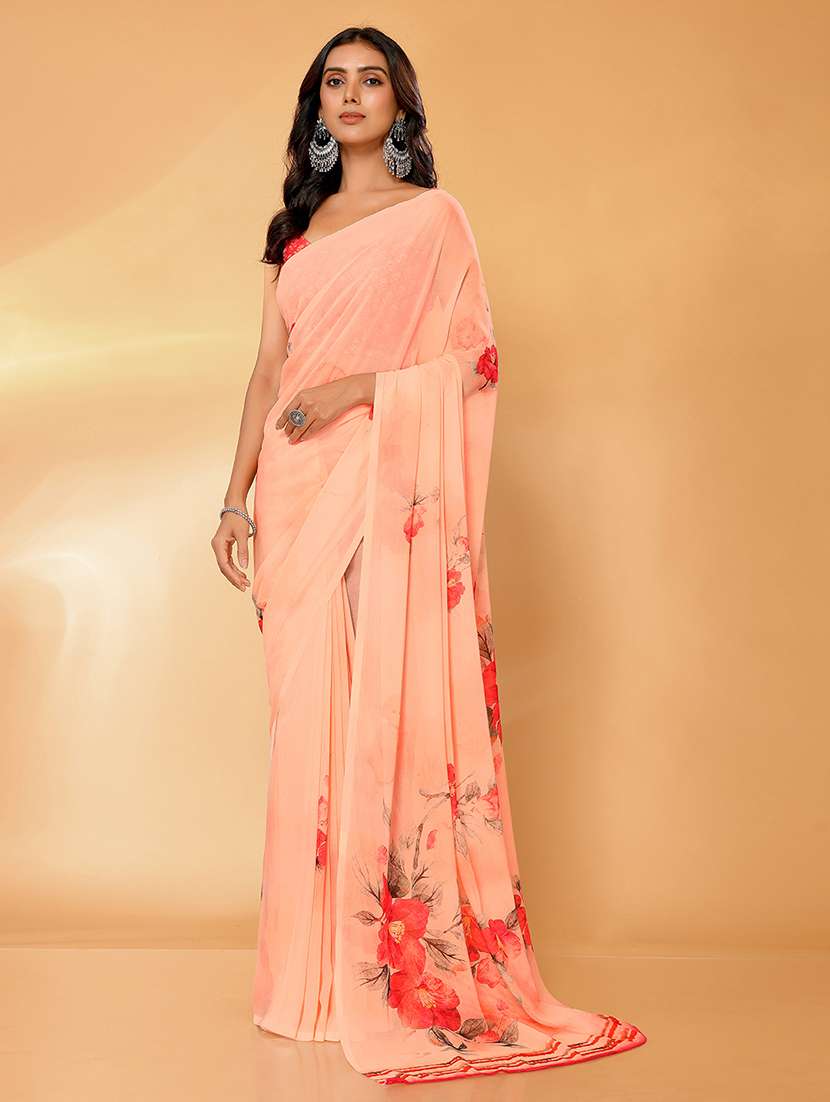 women peach printed saree with blouse