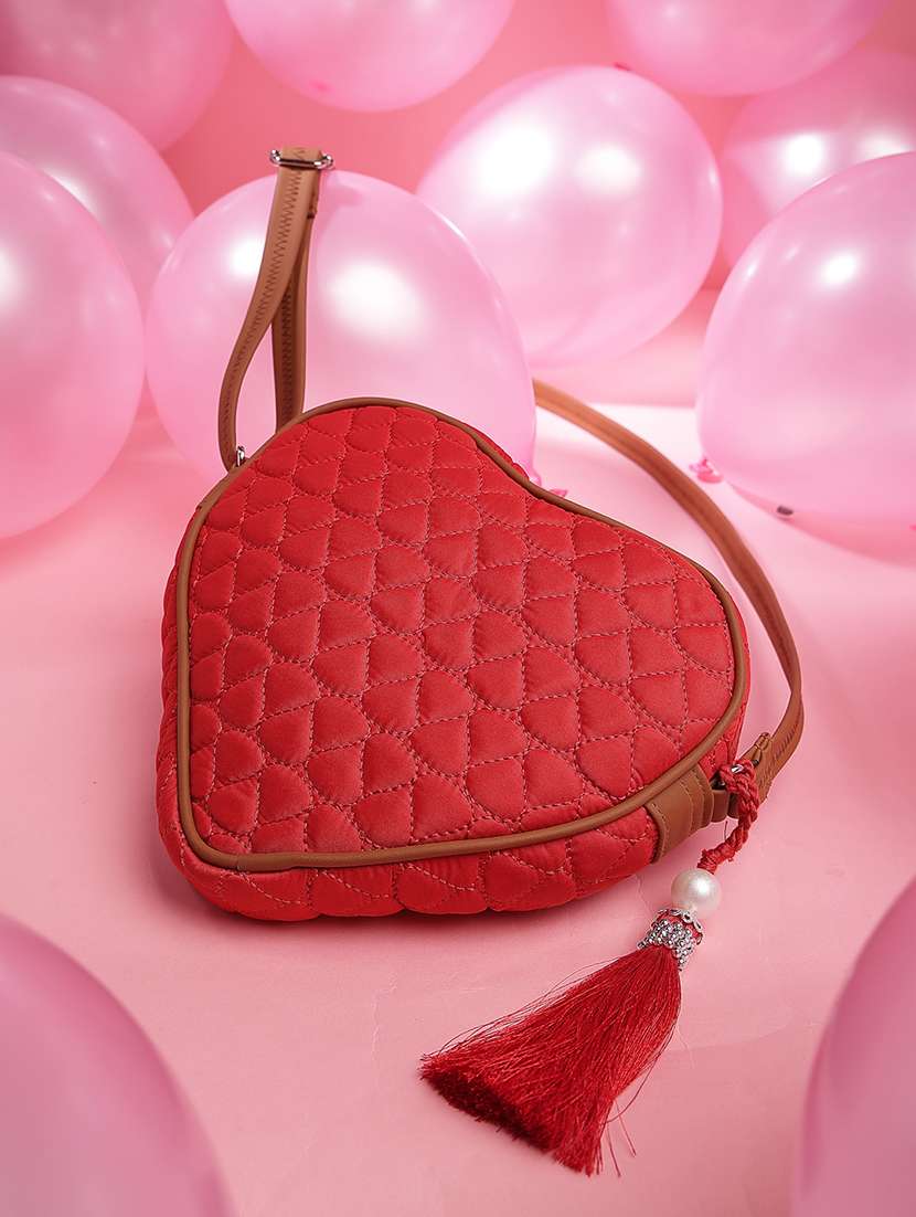 women solid quilted heart shape sling bag