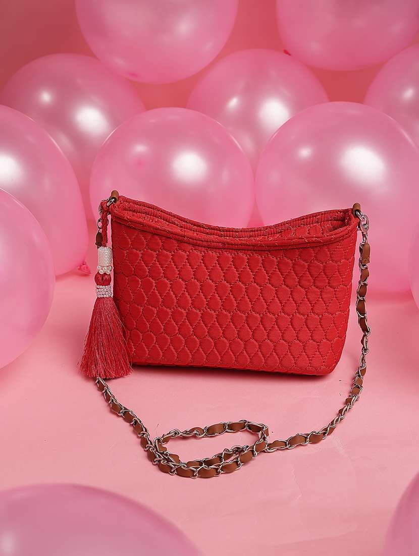women red solid quilted sling bag