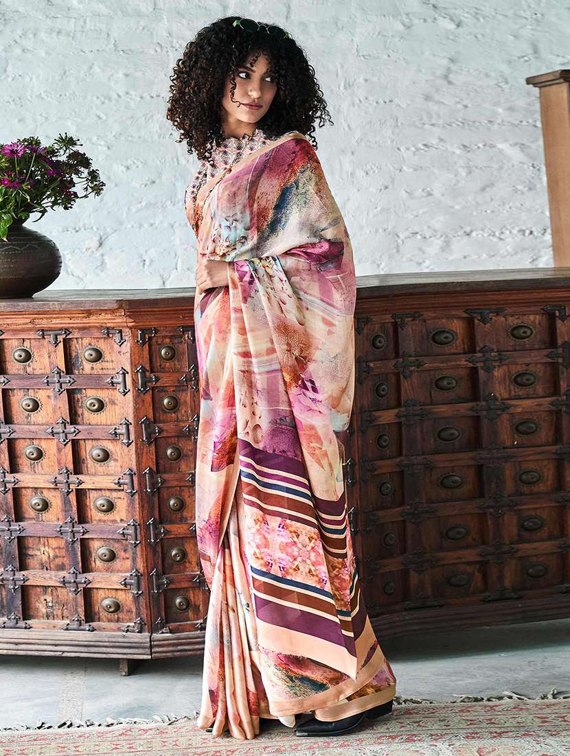 women peach printed saree with blouse