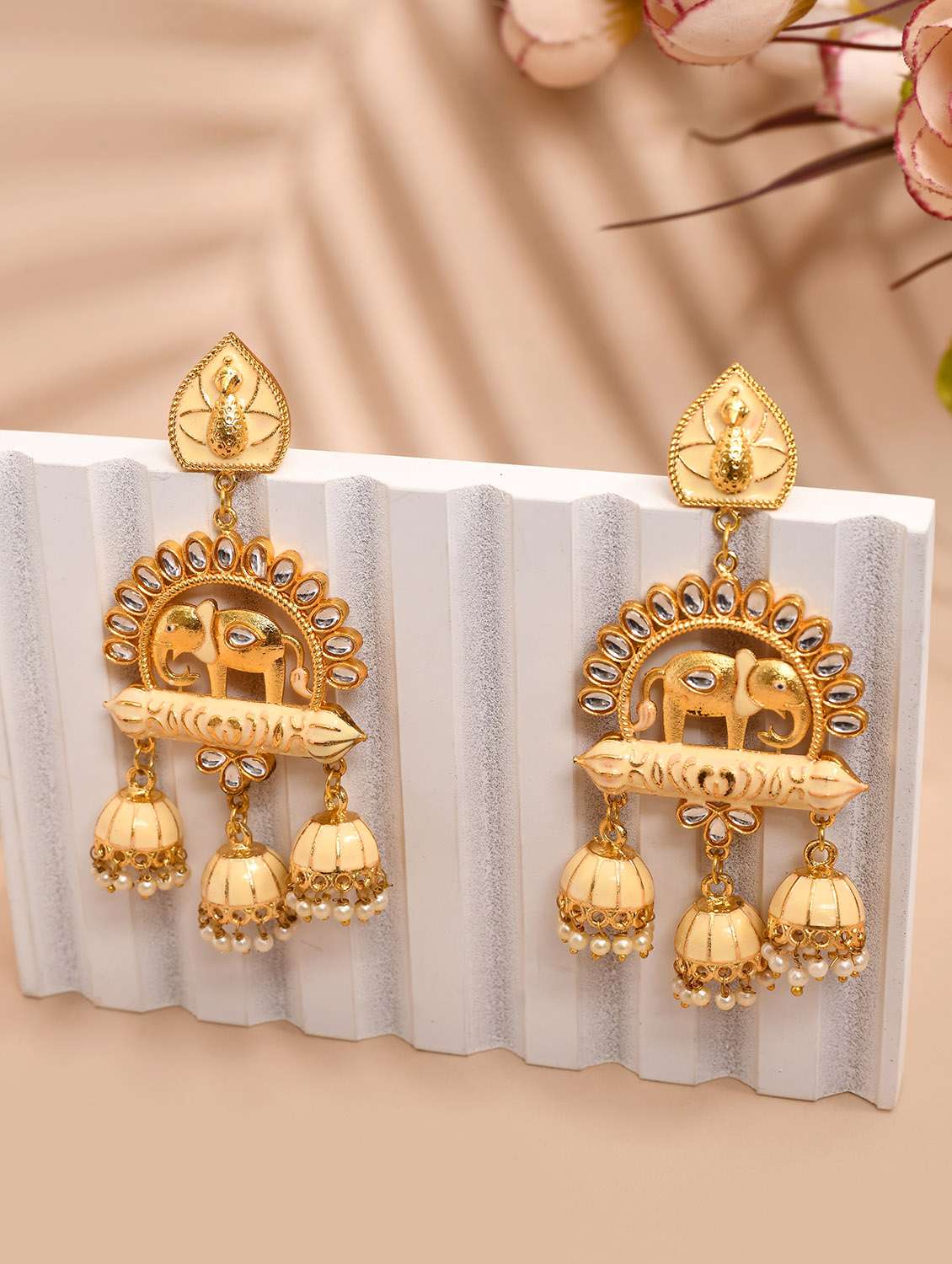 gold-plated animal shaped kundan drop earrings
