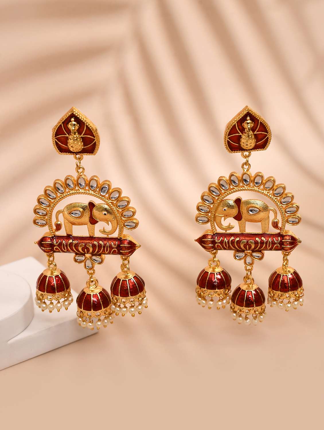 gold-plated animal shaped kundan drop earrings