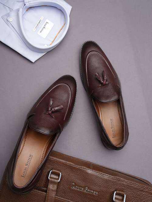 men solid slip on tassel detailed boatshoes