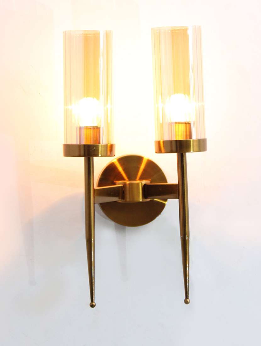 golden finish wall light with cylindrical dual arm | clear glass