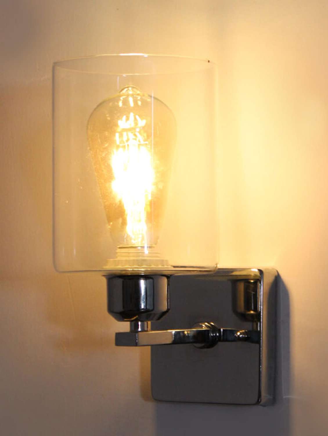 elegant chrome finish clear glass wall sconce