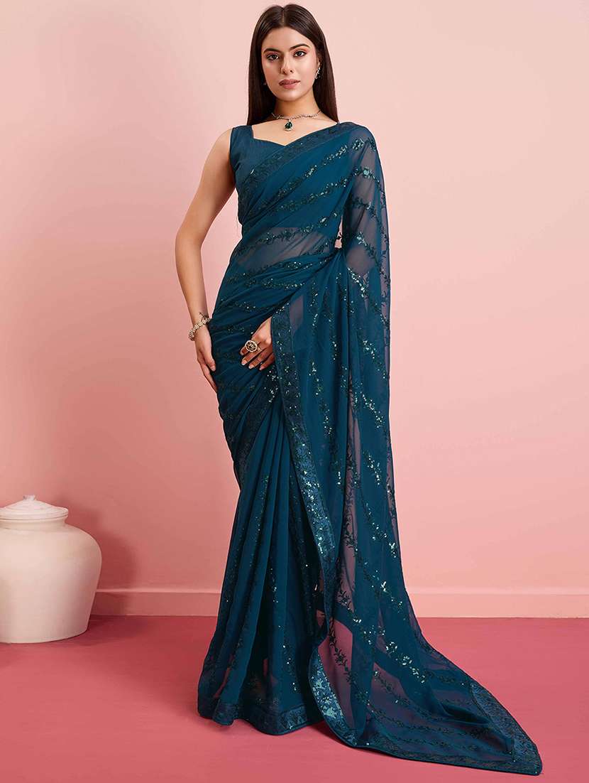 women teal embroidered saree with blouse