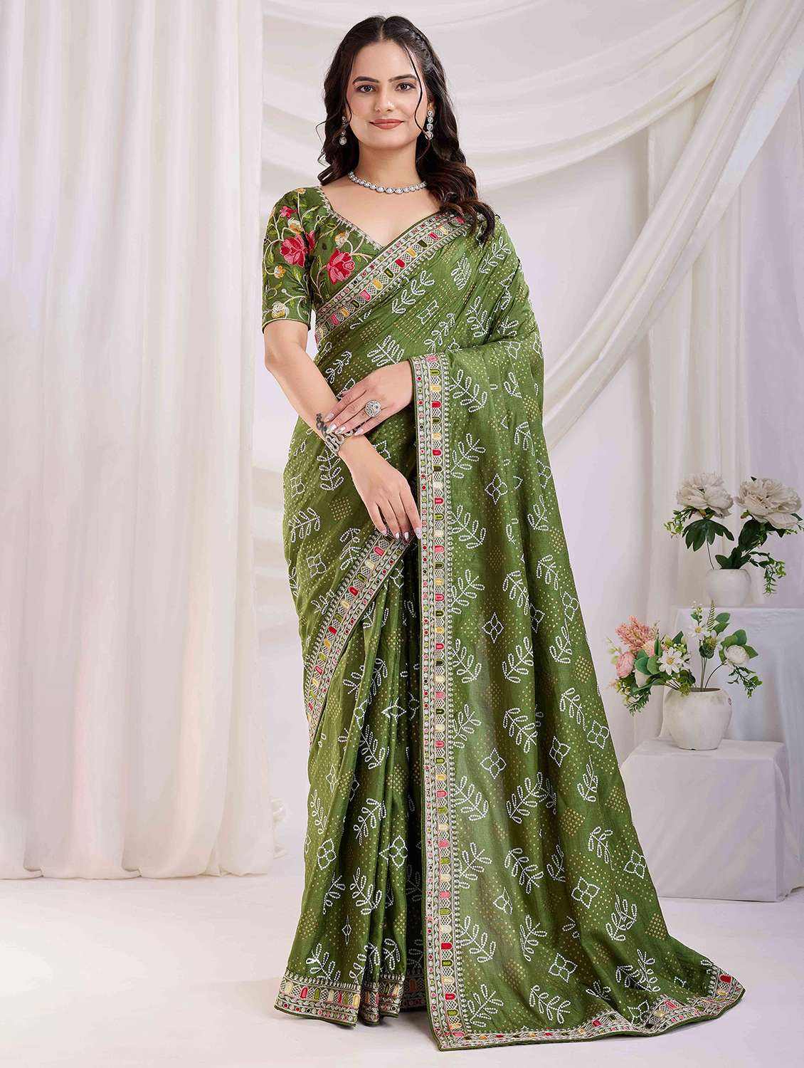 women bandhani printed bordered saree with blouse
