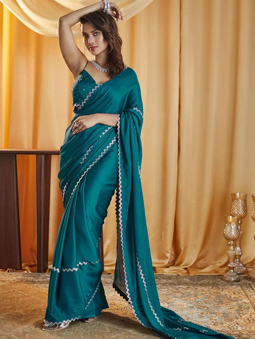 women solid with work embellished saree with blouse