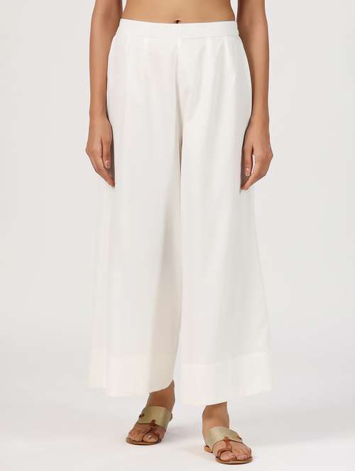 women white solid mid rise flared palazzo