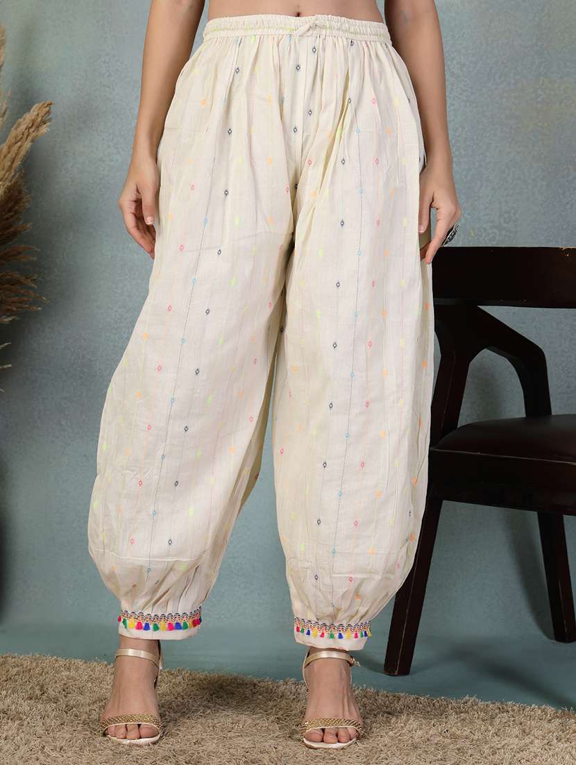 women cream self design mid rise salwar