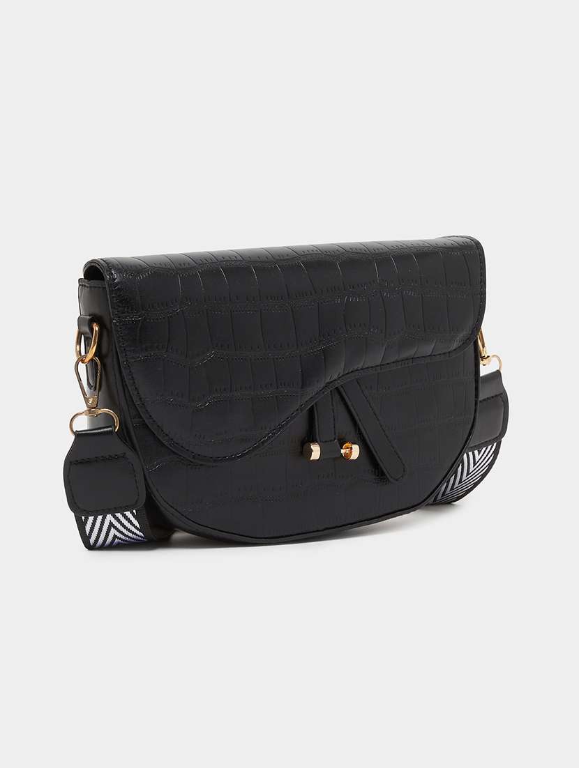 women black textured sling bag