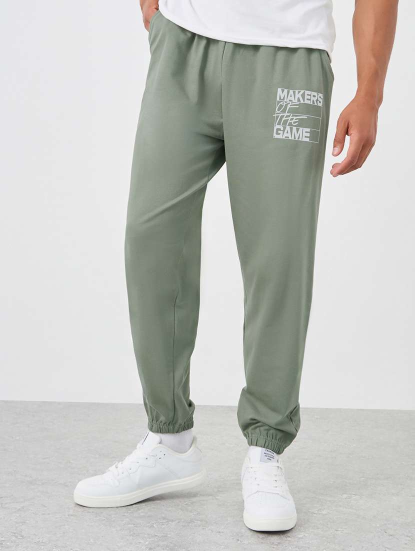 men placement print mid rise relaxed fit jogger - 21971580 -  Standard Image - 1