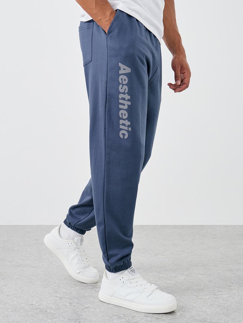 men typographic mid rise relaxed fit jogger - 21971582 - Zoom Image - 0