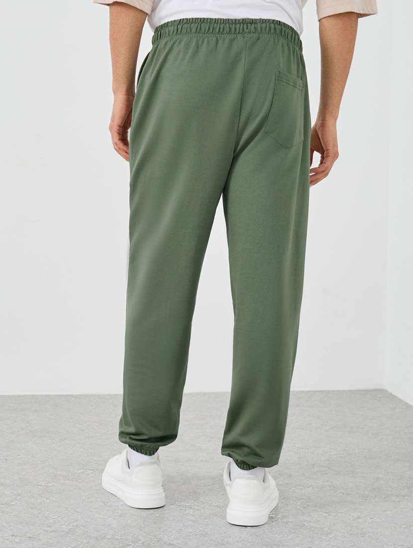 men typographic mid rise loose fit jogger - 21971630 -  Standard Image - 1