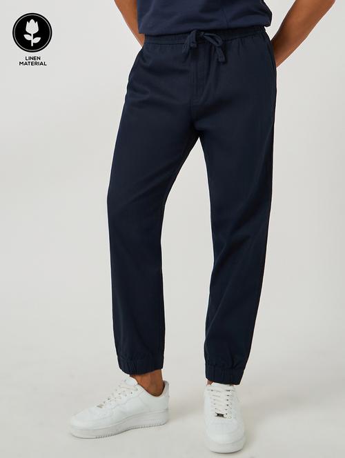 men solid mid rise relaxed fit jogger - 21971706 - Standard Image - 0