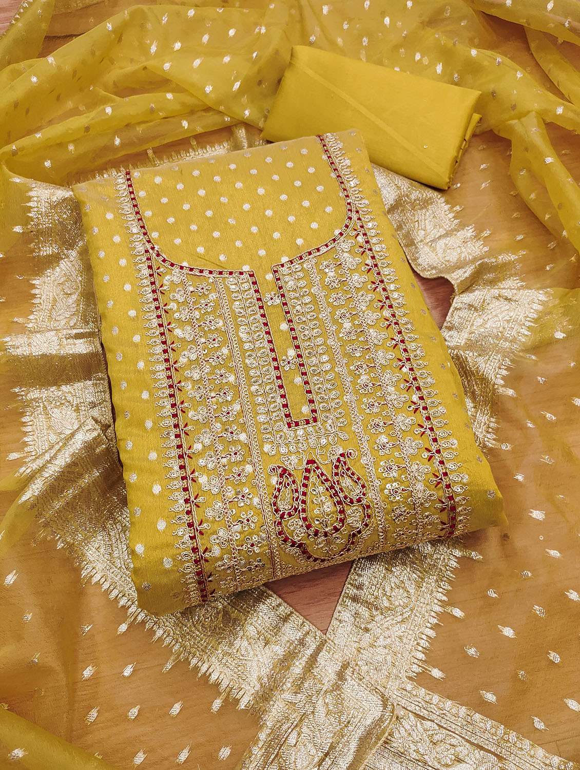 women self design embroidered unstitched suit set