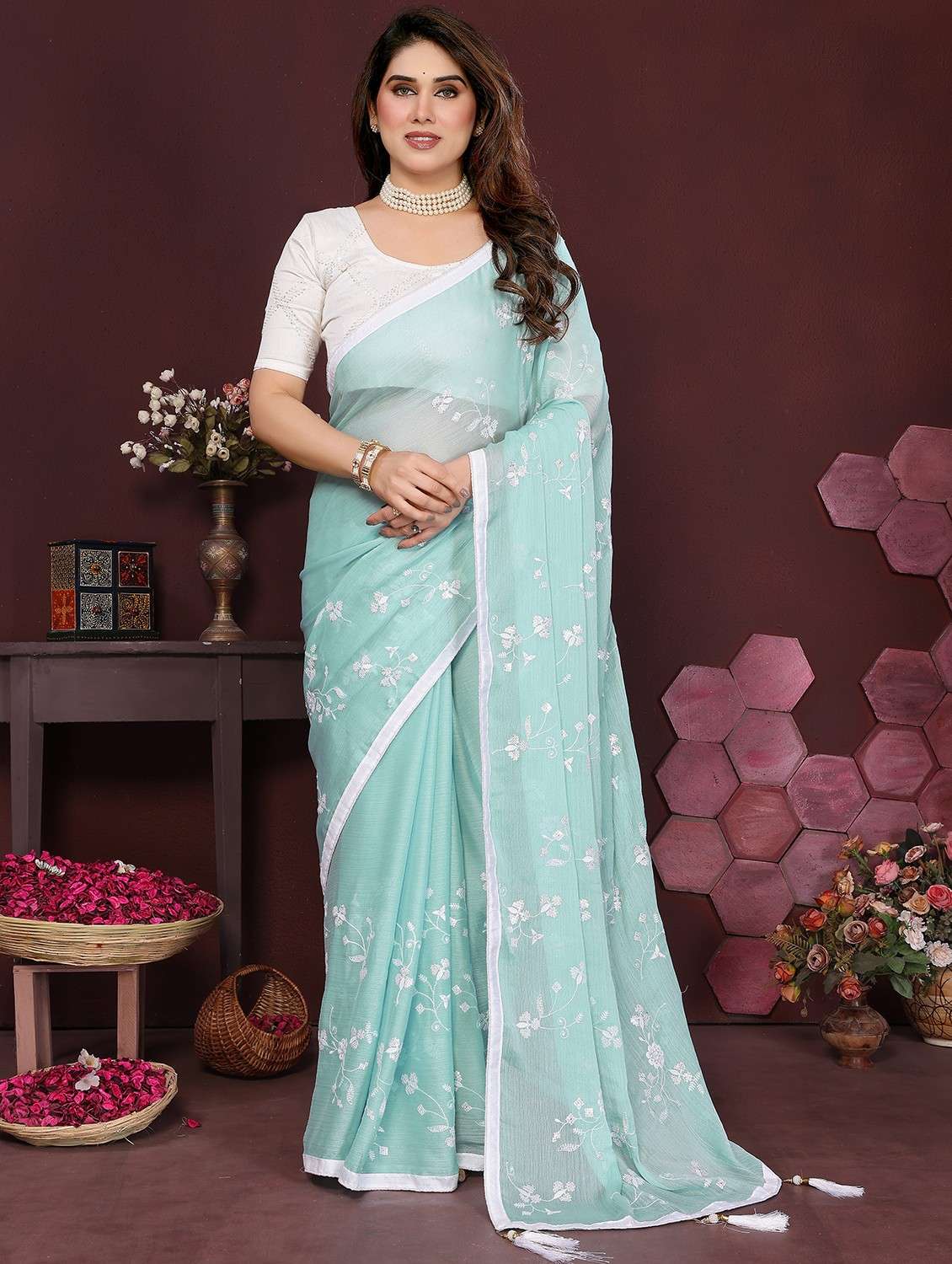women turquoise embroidered saree with blouse