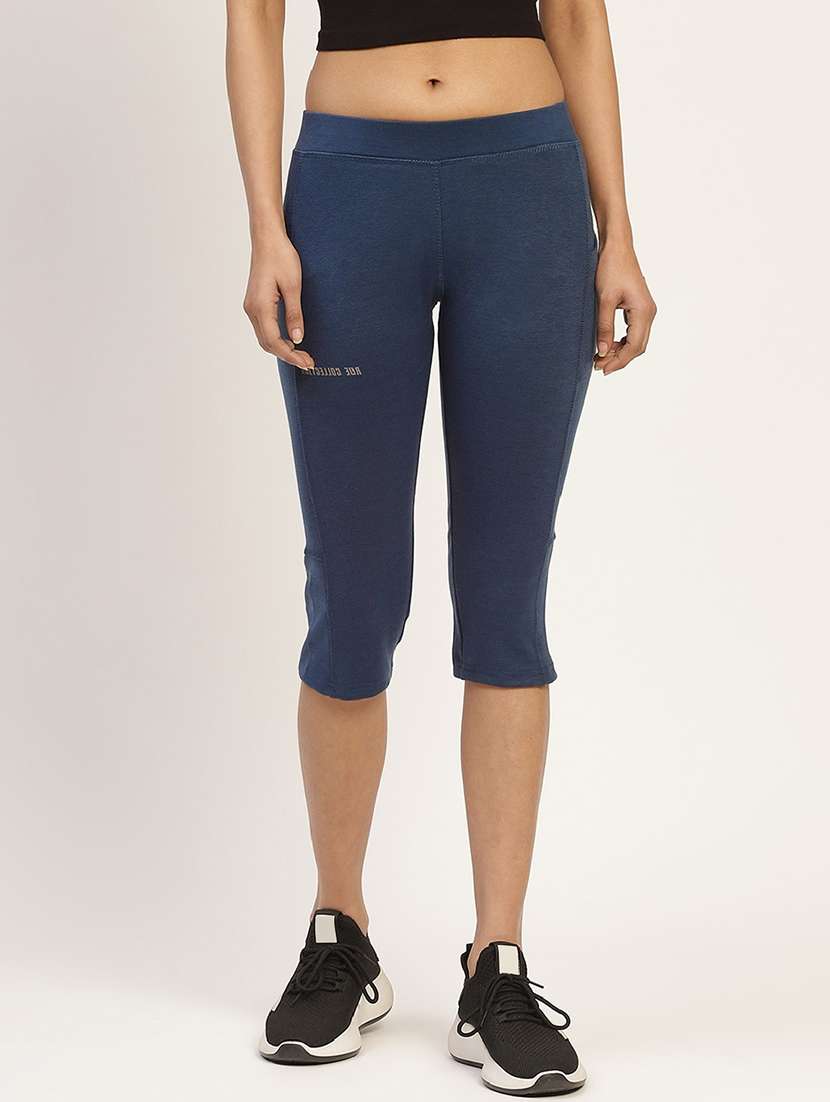 women blue solid mid rise slim fit capri