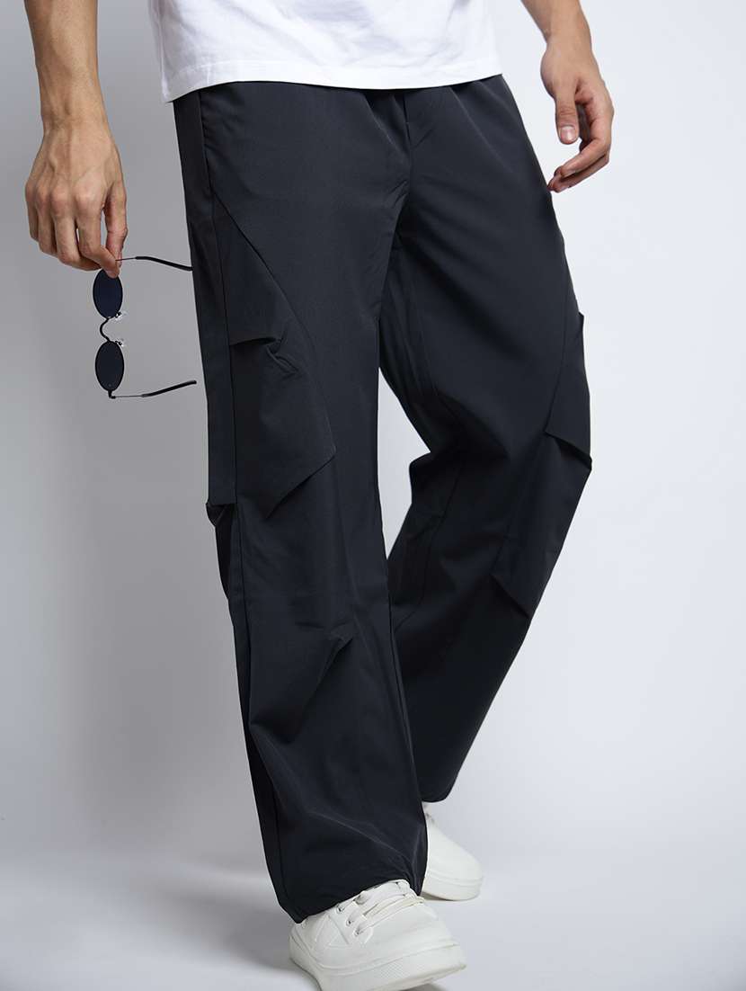 men solid mid rise loose fit parachute pants