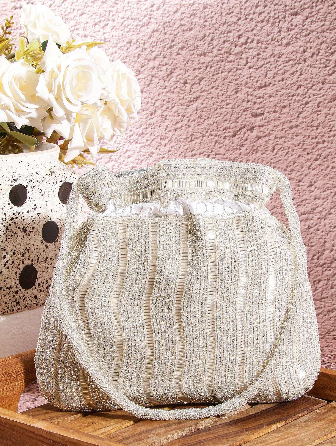 women embellsihed potli bag