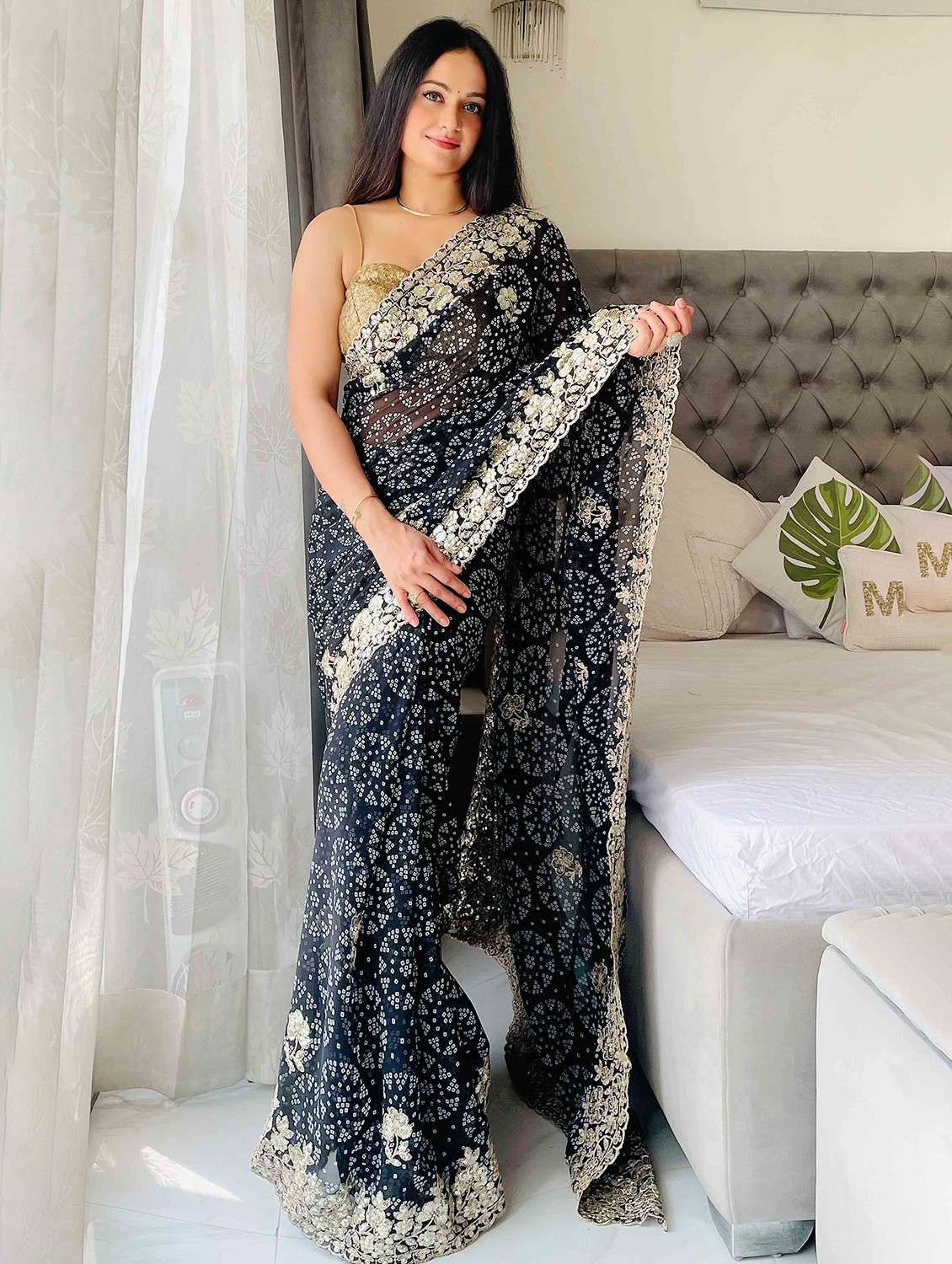 women bandhani printed bordered saree with blouse