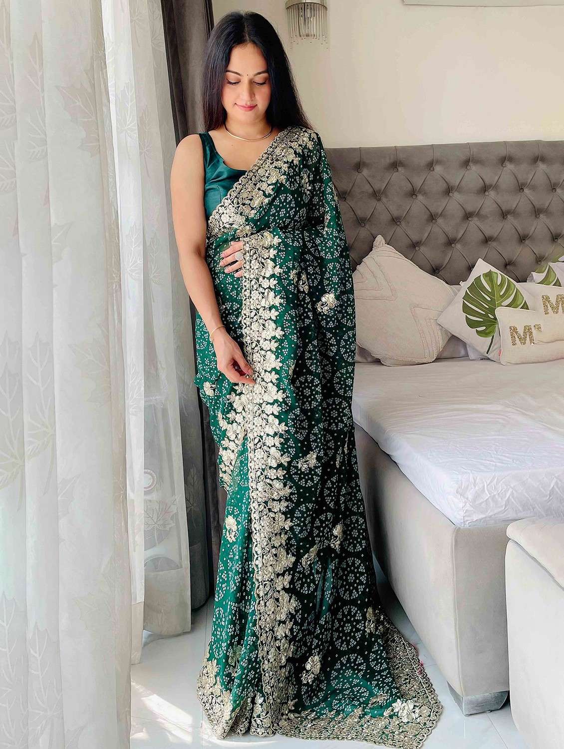 women bandhani printed bordered saree with blouse