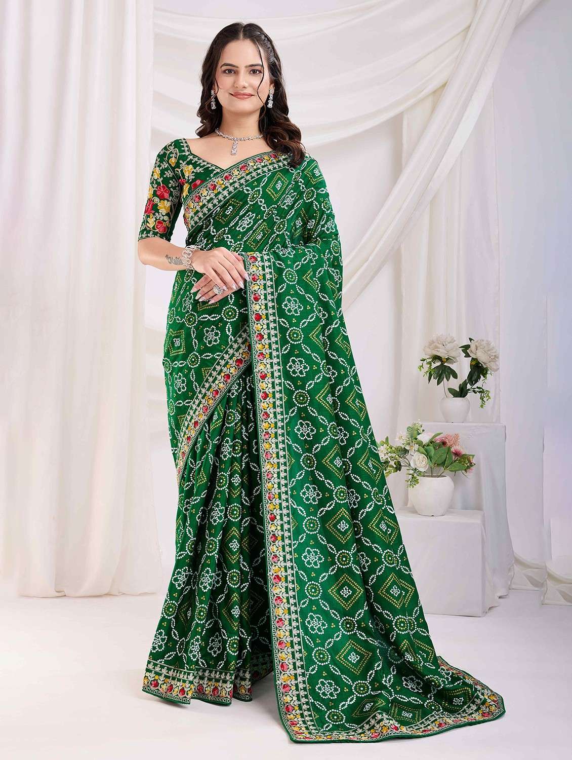 women bandhani printed bordered saree with blouse