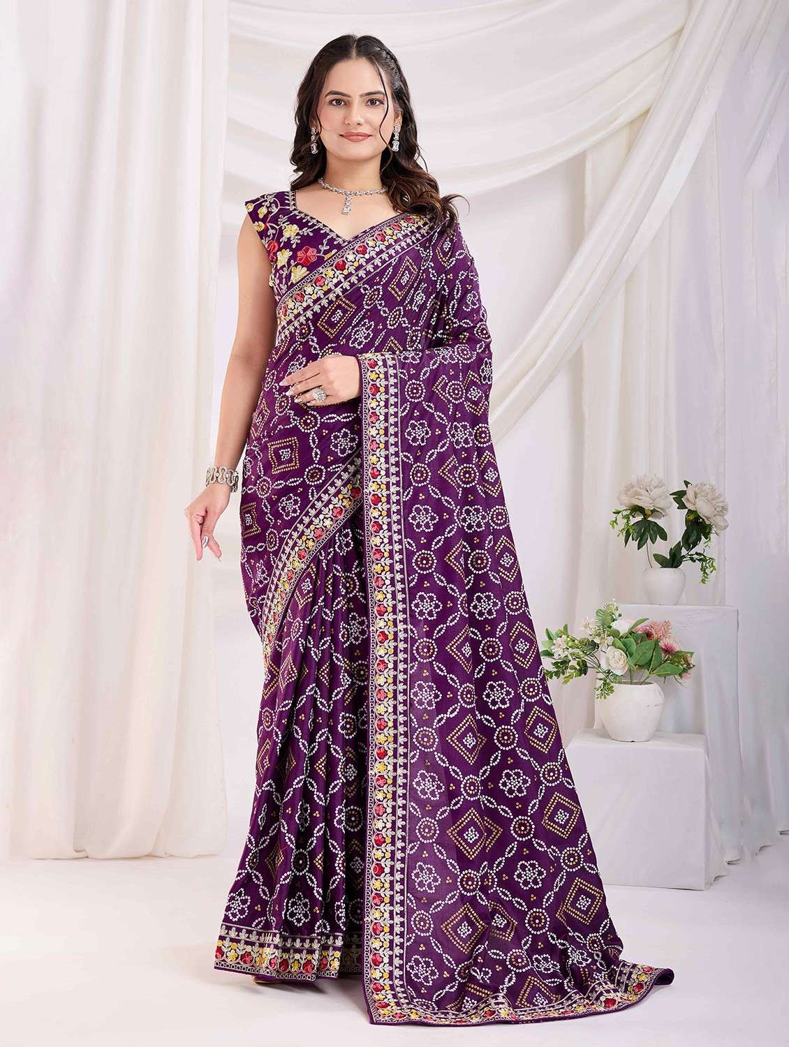 women bandhani printed bordered saree with blouse