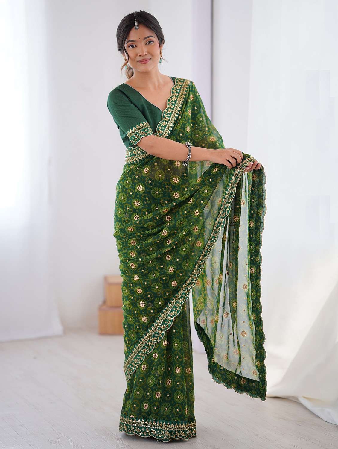 women bandhani printed bordered saree with blouse