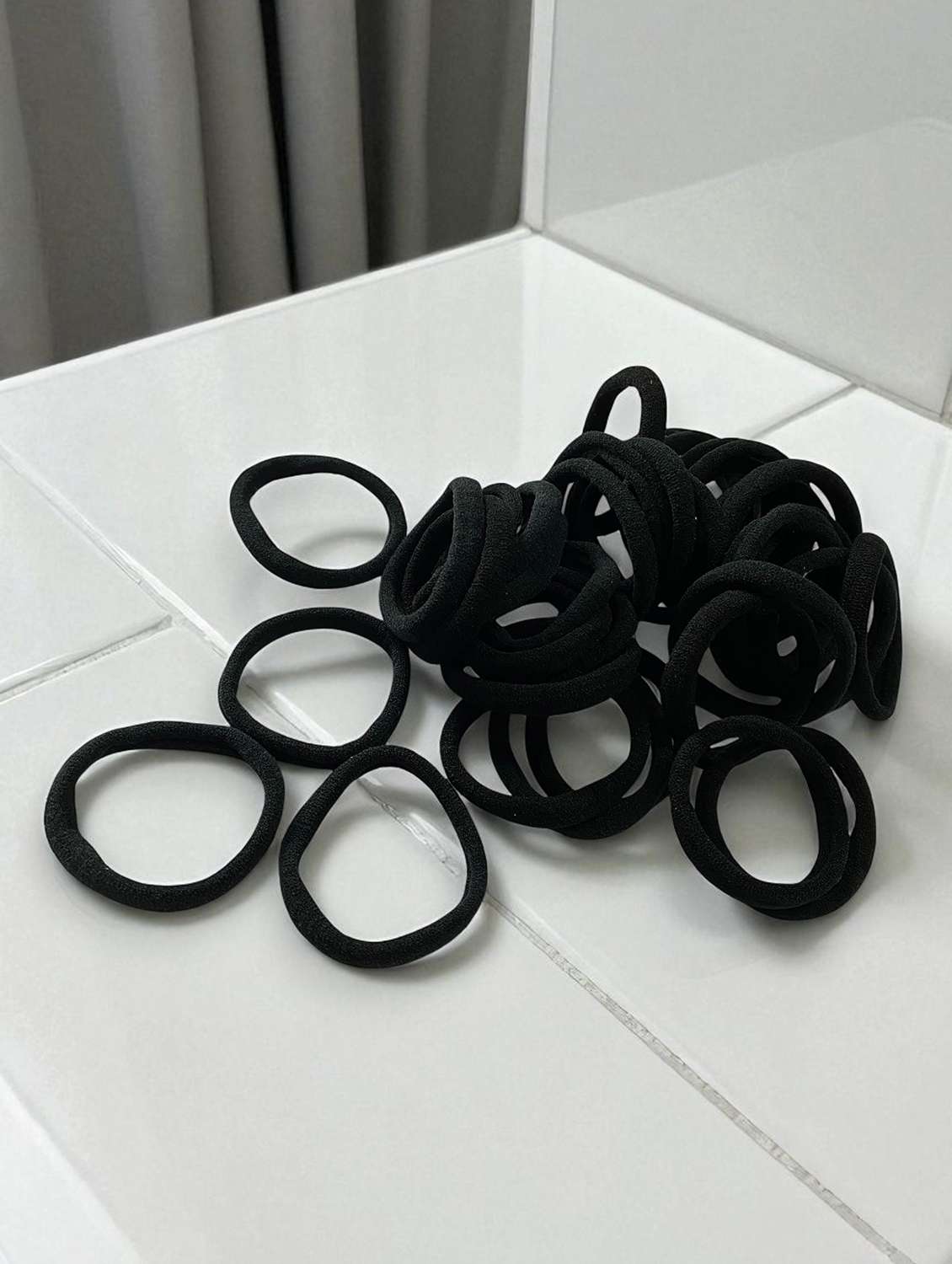 pack of black rubber bands and clutchers - 22051997 -  Standard Image - 1