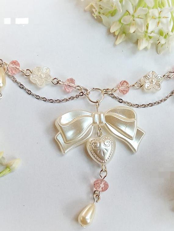 pearl beaded bow detailed necklace - 22055059 - Standard Image - 1