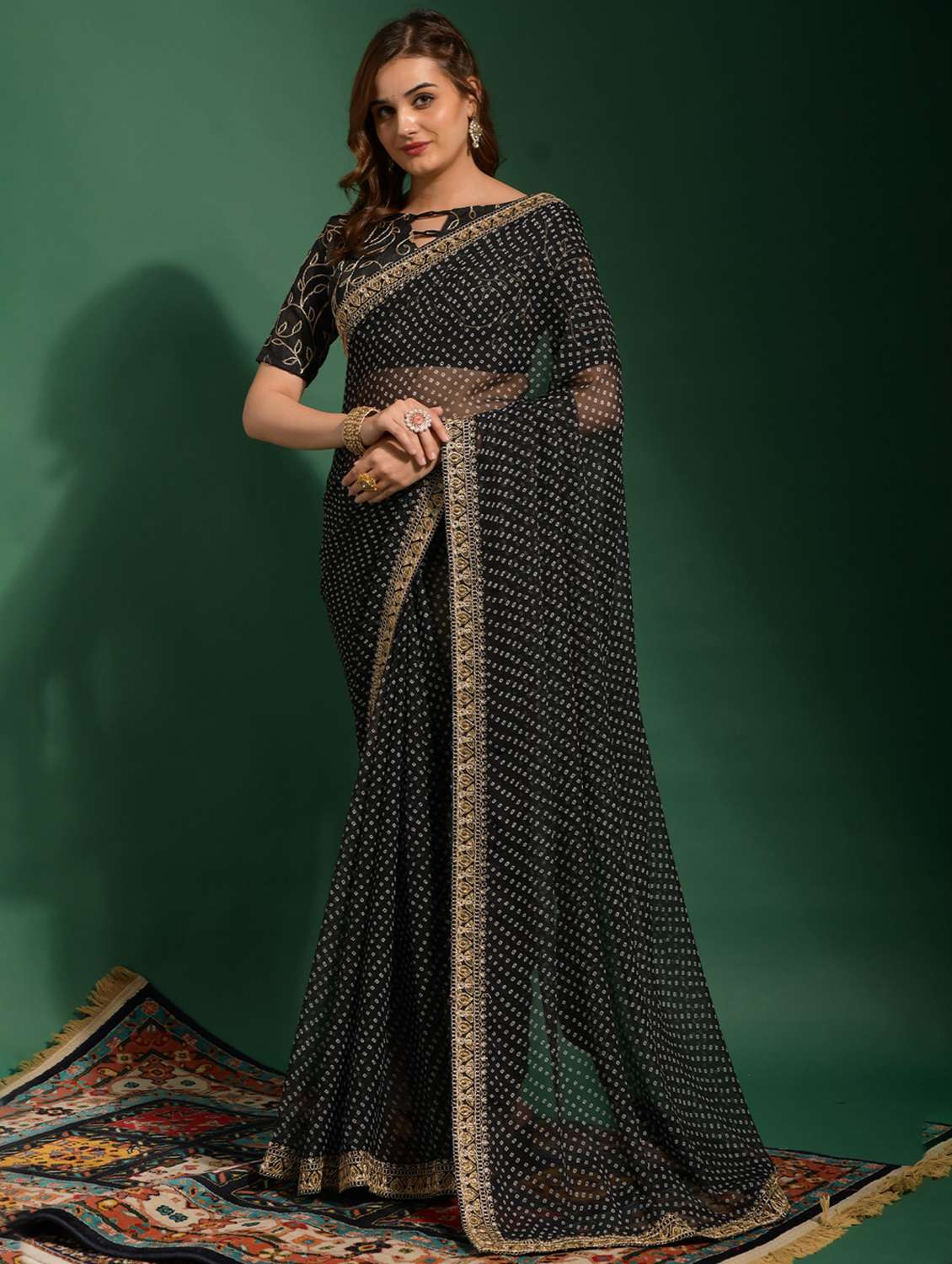 women bandhani printed bordered saree with blouse