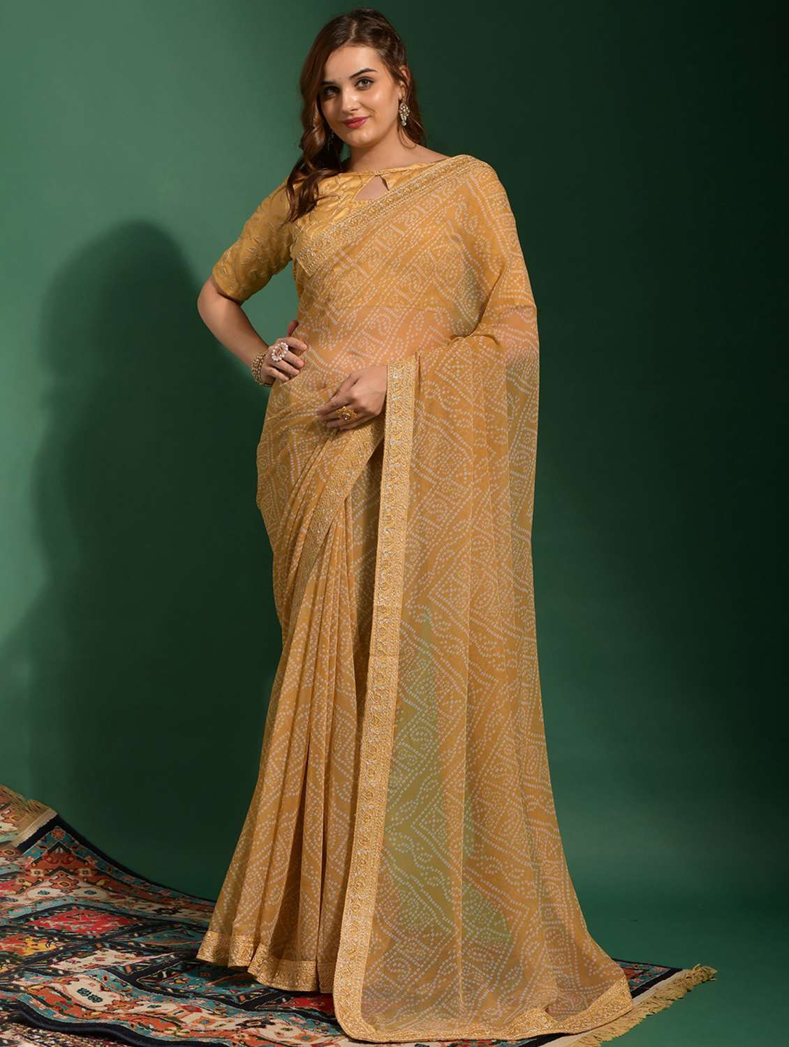 women bandhani printed bordered saree with blouse