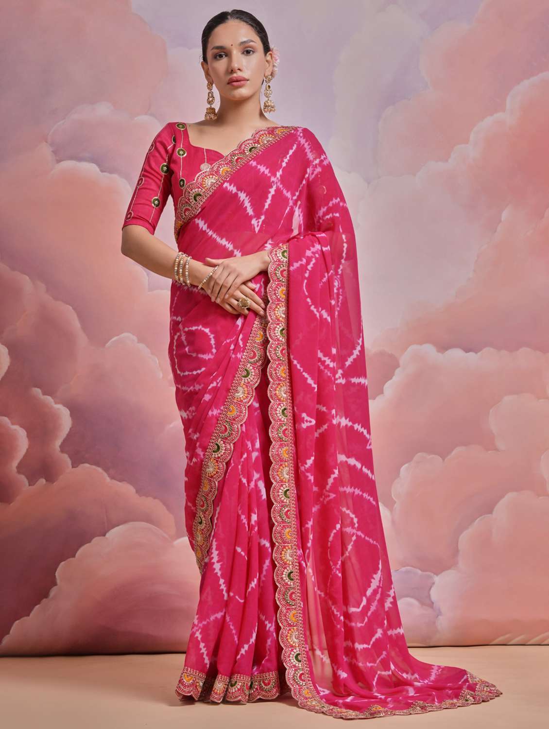 women tie & dye printed bordered saree with blouse