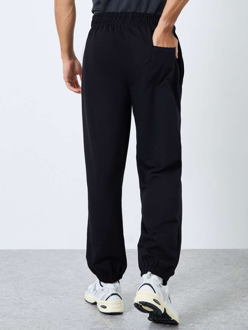 men typographic mid rise relaxed fit jogger - 22083315 -  Standard Image - 1