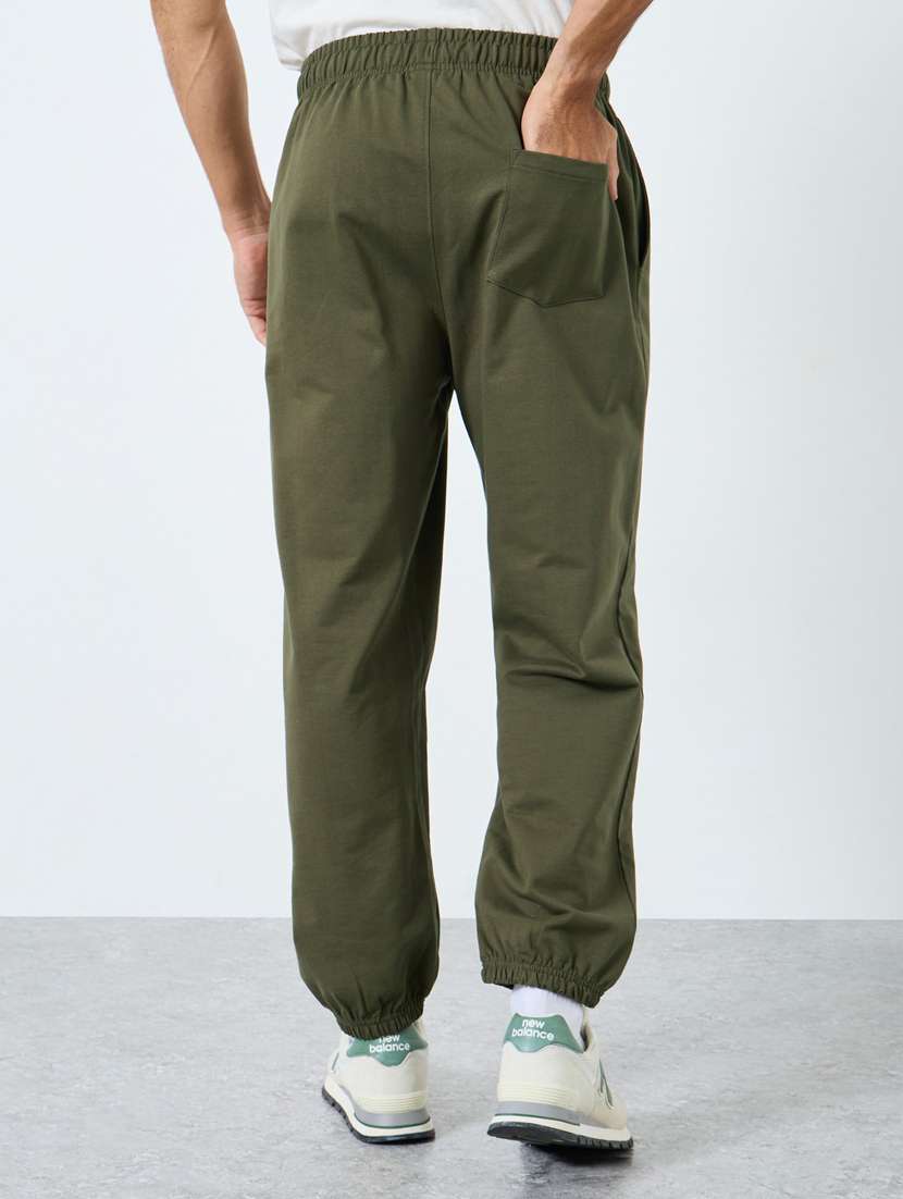 men typographic mid rise relaxed fit jogger - 22083316 -  Standard Image - 1