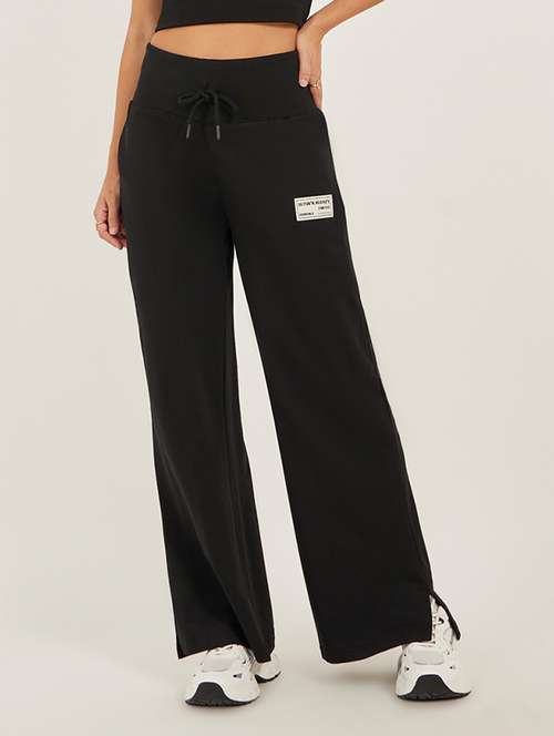 women solid mid rise relaxed fit track pant - 22083456 - Standard Image - 0