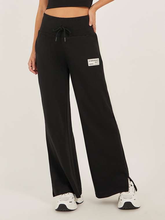 women solid mid rise relaxed fit track pant - 22083456 - Zoom Image - 0