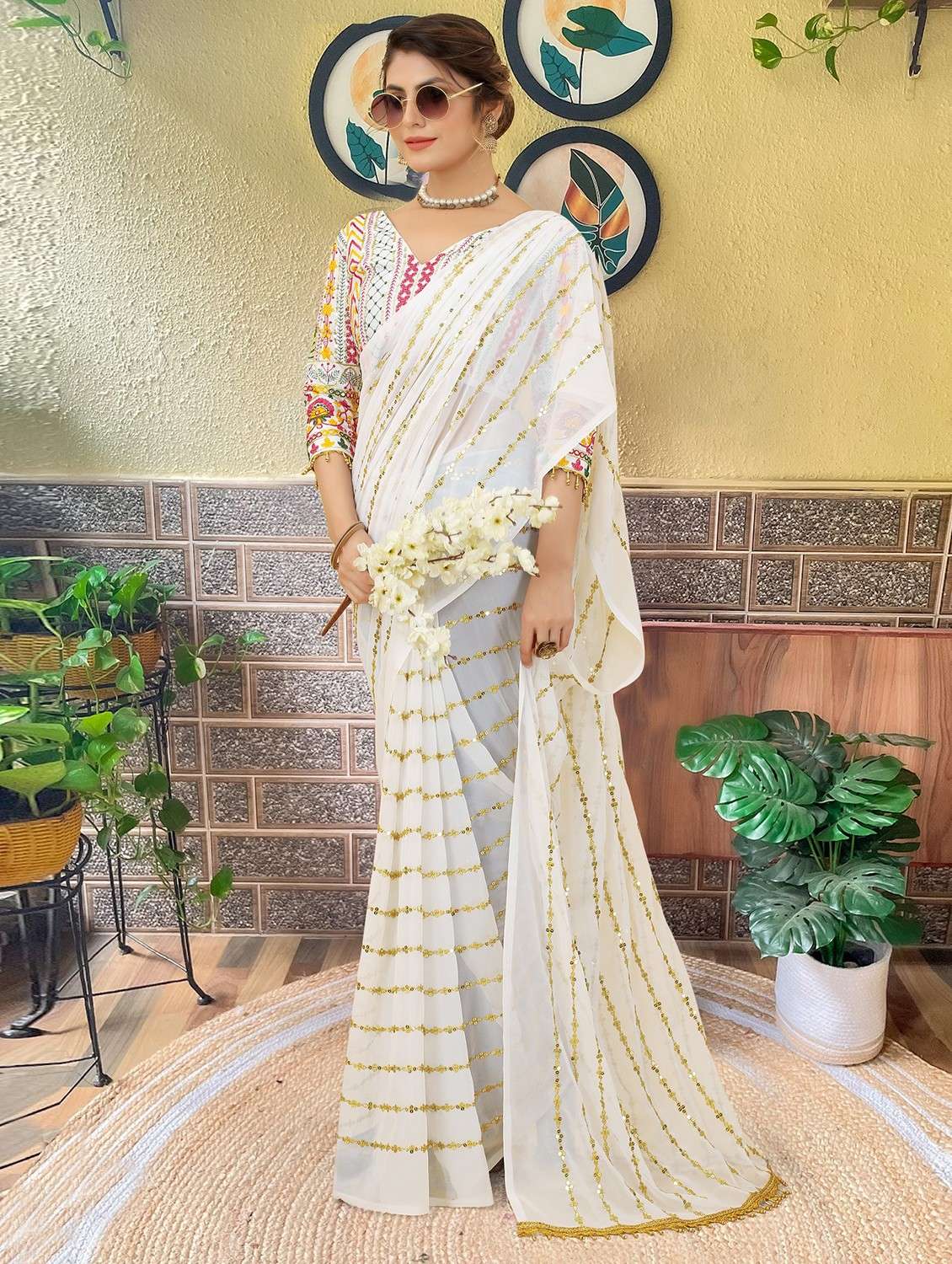 women solid with work embellished saree with blouse