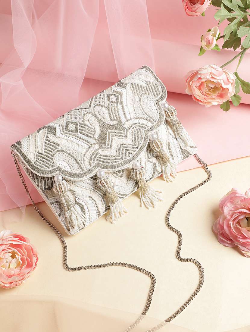 embellished sling bag with tassels and chain