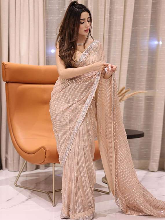 women solid with work embellished saree with blouse