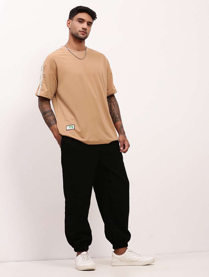   men solid mid rise relaxed fit jogger - 22173639 -  Standard Image - 4