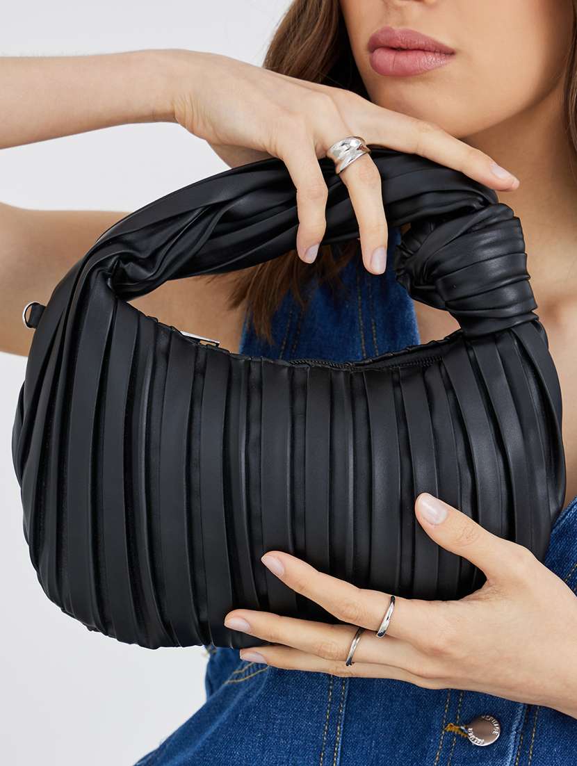 women black textured handbag