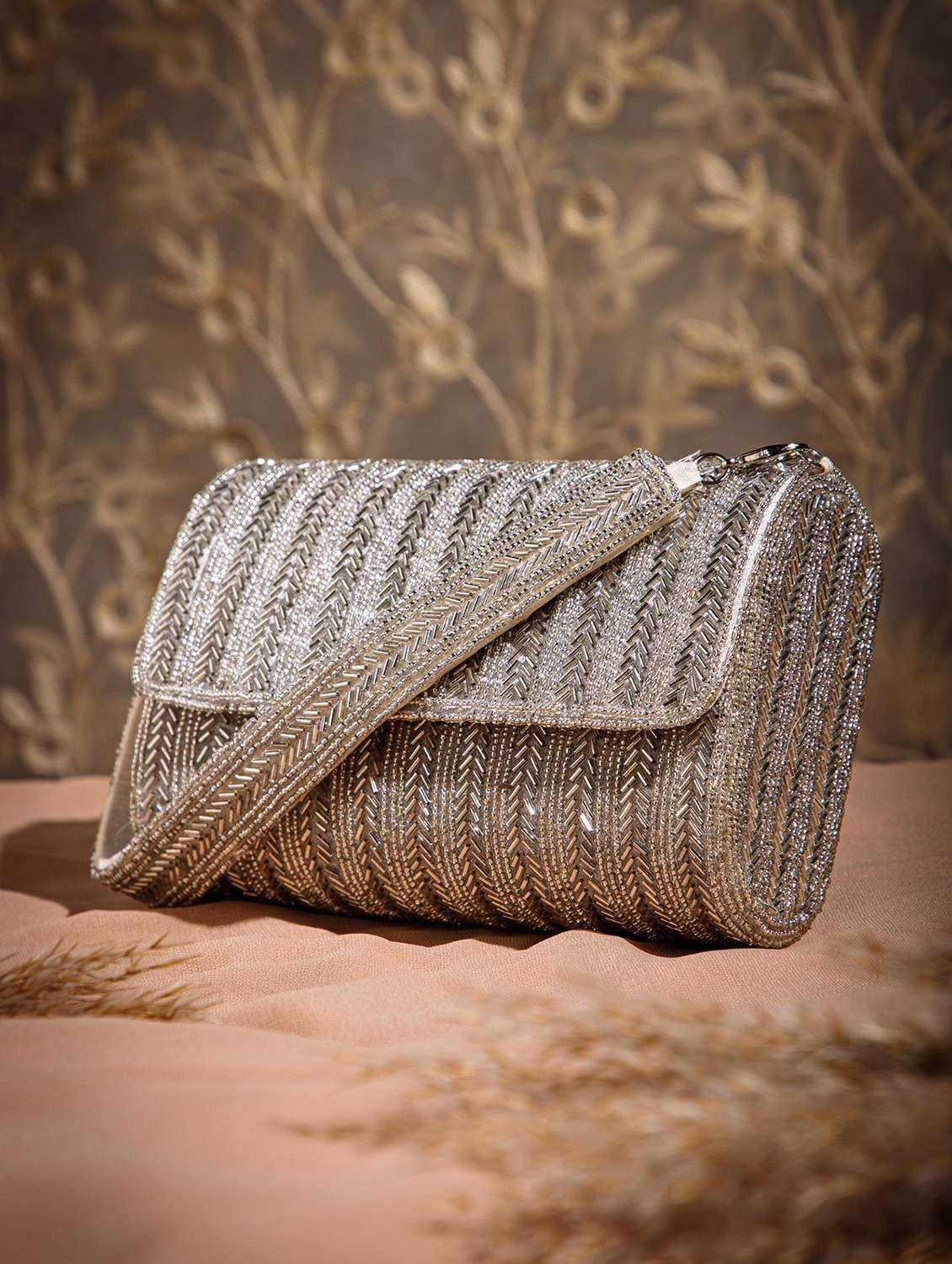 women silver embellished fold over clutch