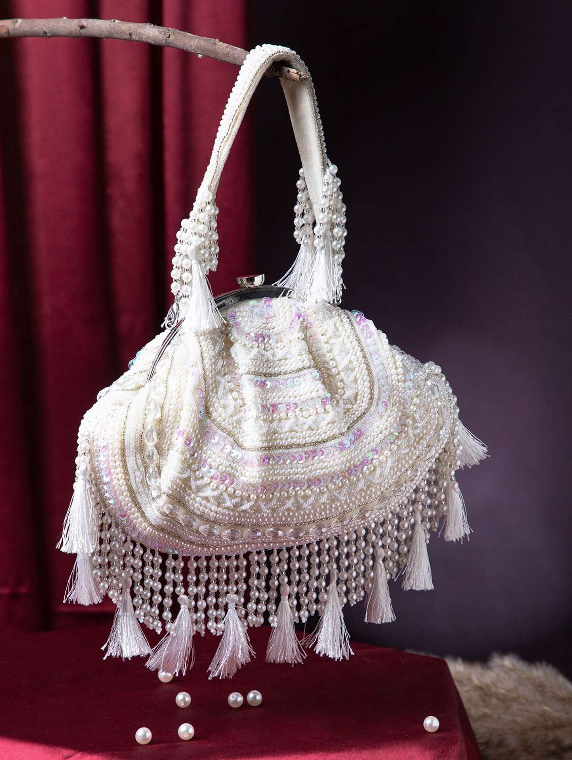 women embellished cream velvet clutch with tassels