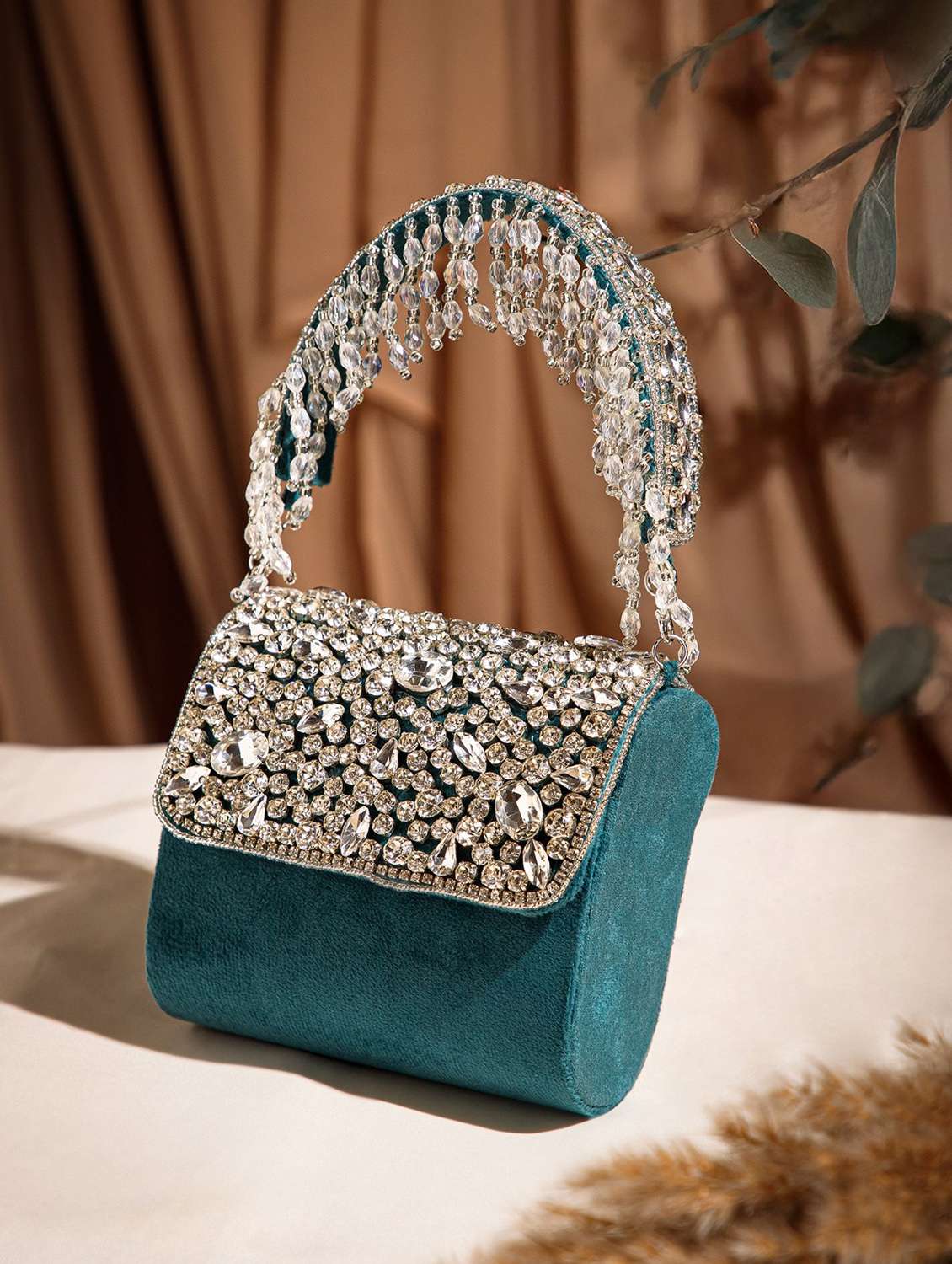 women teal embellished suede clutch 